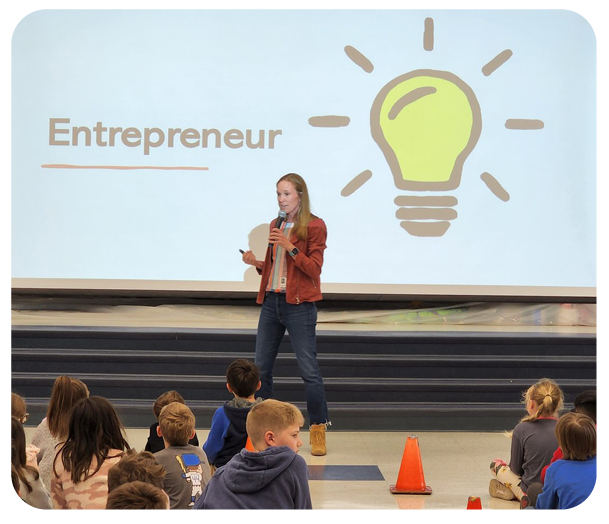 Lowey Bundy Sichol presenting to grade school children about entrepreneurship