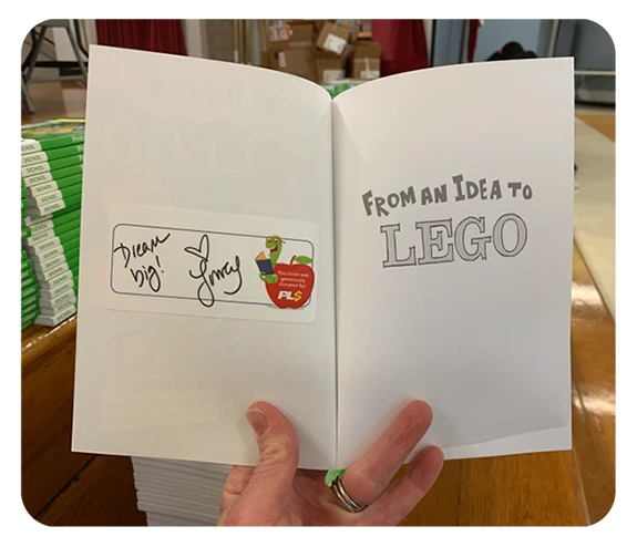 The inside of "From an Idea to Lego" that has been signed by Lowey Bundy Sichol