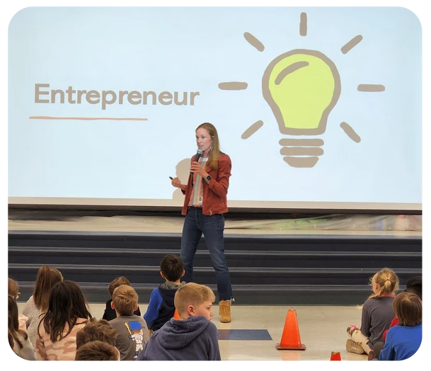 Lowey Bundy Sichol presenting to grade school children about entrepreneurship