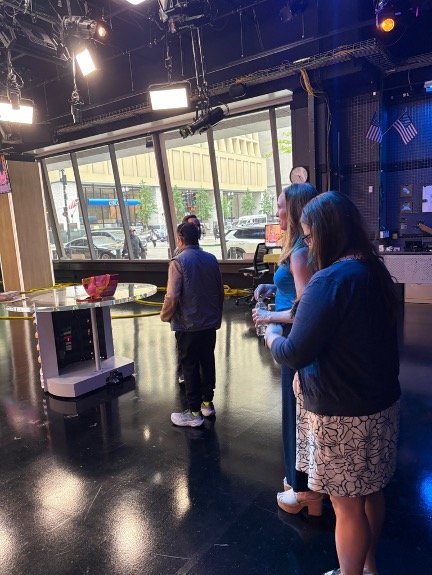 “Behind-the-scenes view during LetMeFail media appearance at CBS Chicago Studio A, with Lowey Bundy Sichol and team observing production.”